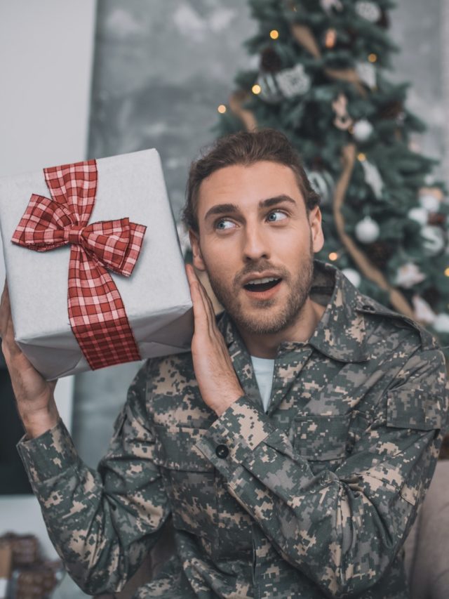 cropped-young-man-in-camouflage-uniform-giving-a-gift-to-mom.jpg