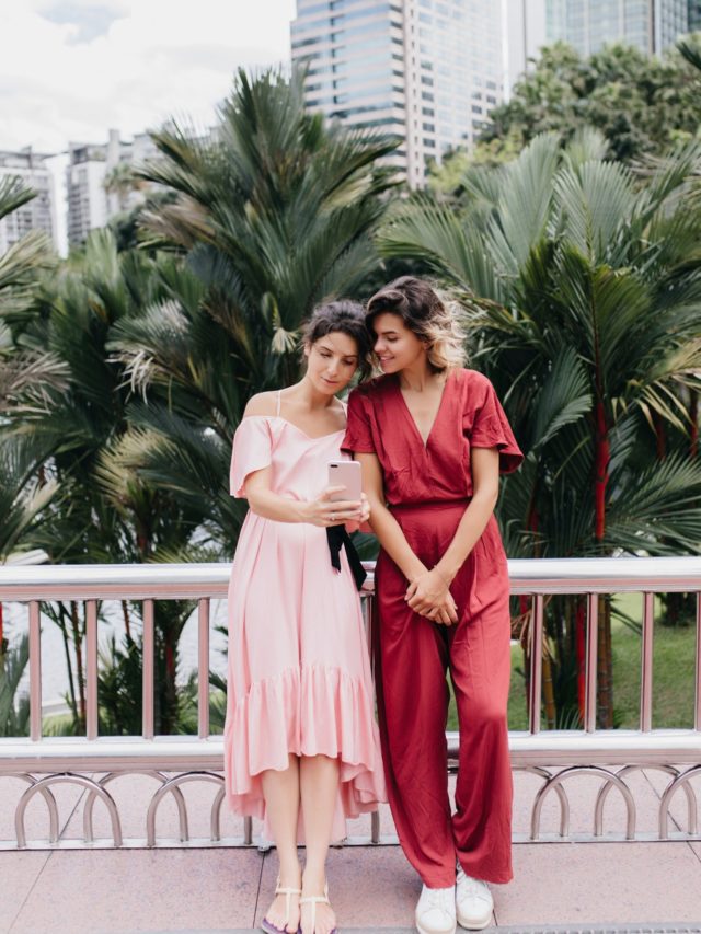 cropped-full-length-portrait-of-blonde-woman-in-red-outfit-posing-with-skyscrapers-on-background-outdoor-s.jpg