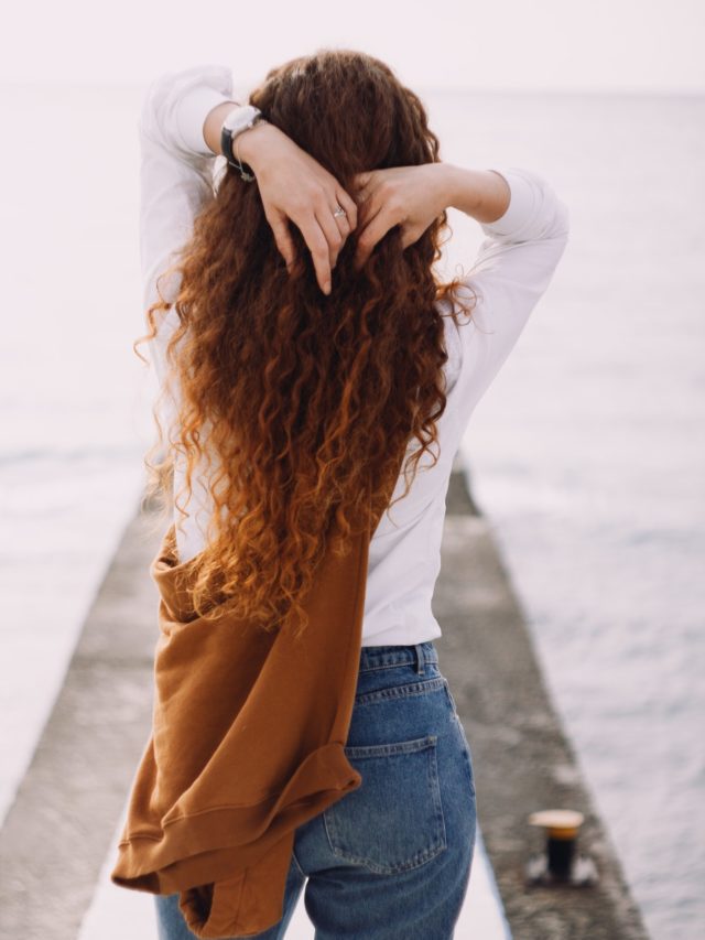 cropped-woman-with-long-red-hair-near-the-sea.jpg