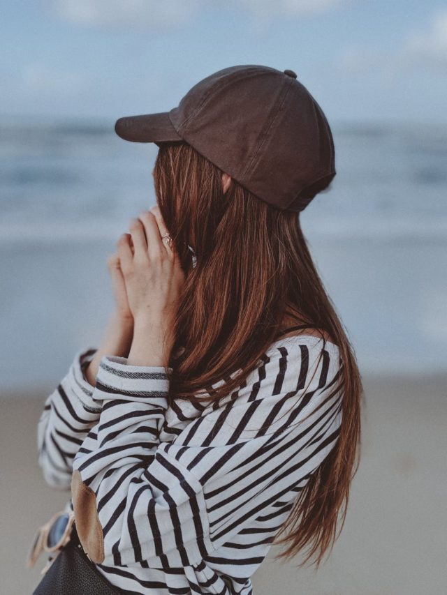 shallow focus photo of woman wearing striped long sleeves